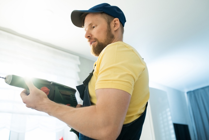 handyman using power drill