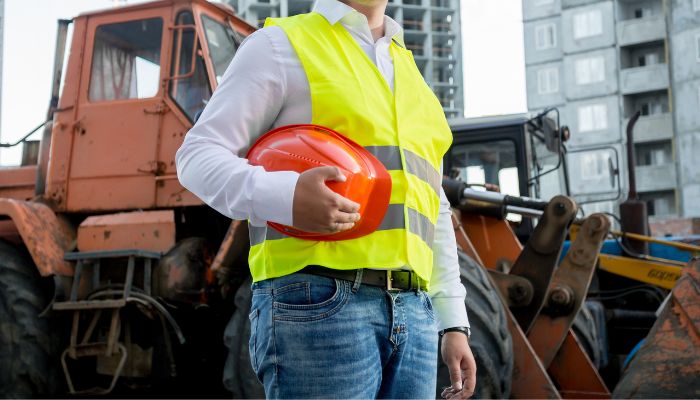 Engineer standing in front of truck